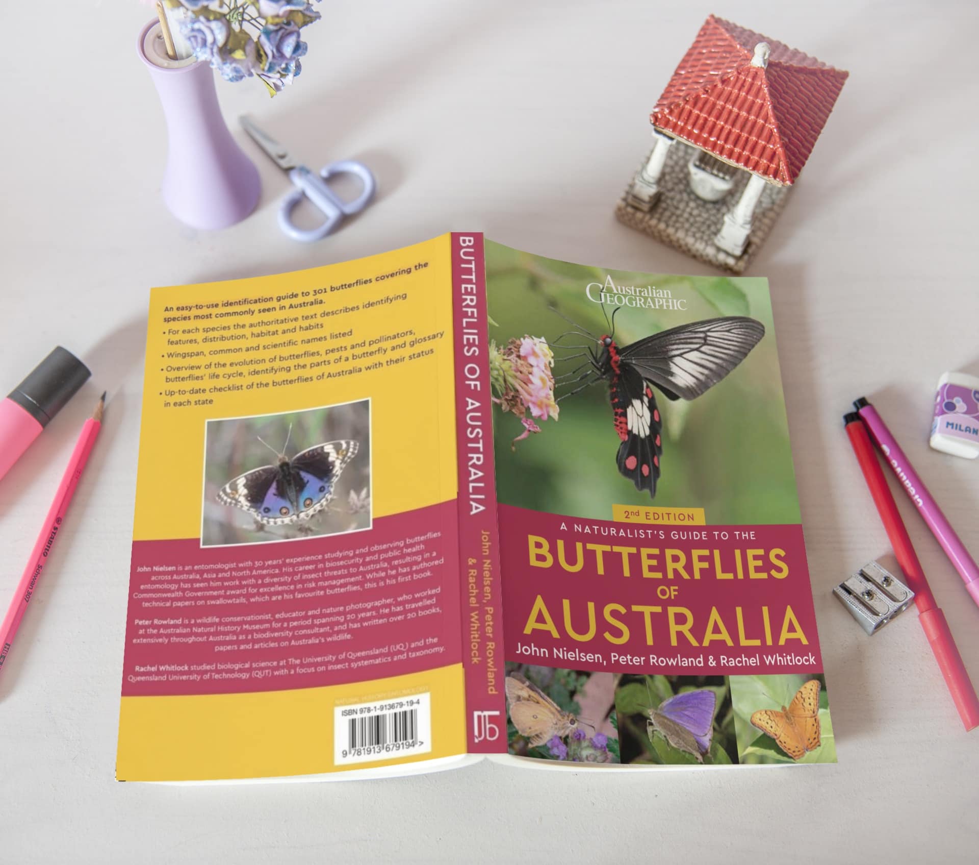 2nd Edition of A Naturalist's Guide to the Butterflies of Australia A copy of the 2nd Edition of A Naturalist's Guide to the Butterflies of Australia lying open and face down on a desk