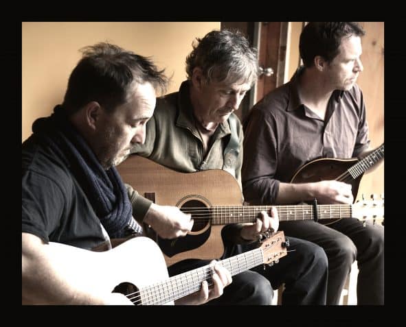 Image of Shane Howard Trio playing guitars